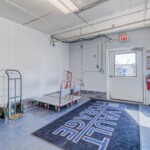 Large hallway with lots of natural light and moving dollies